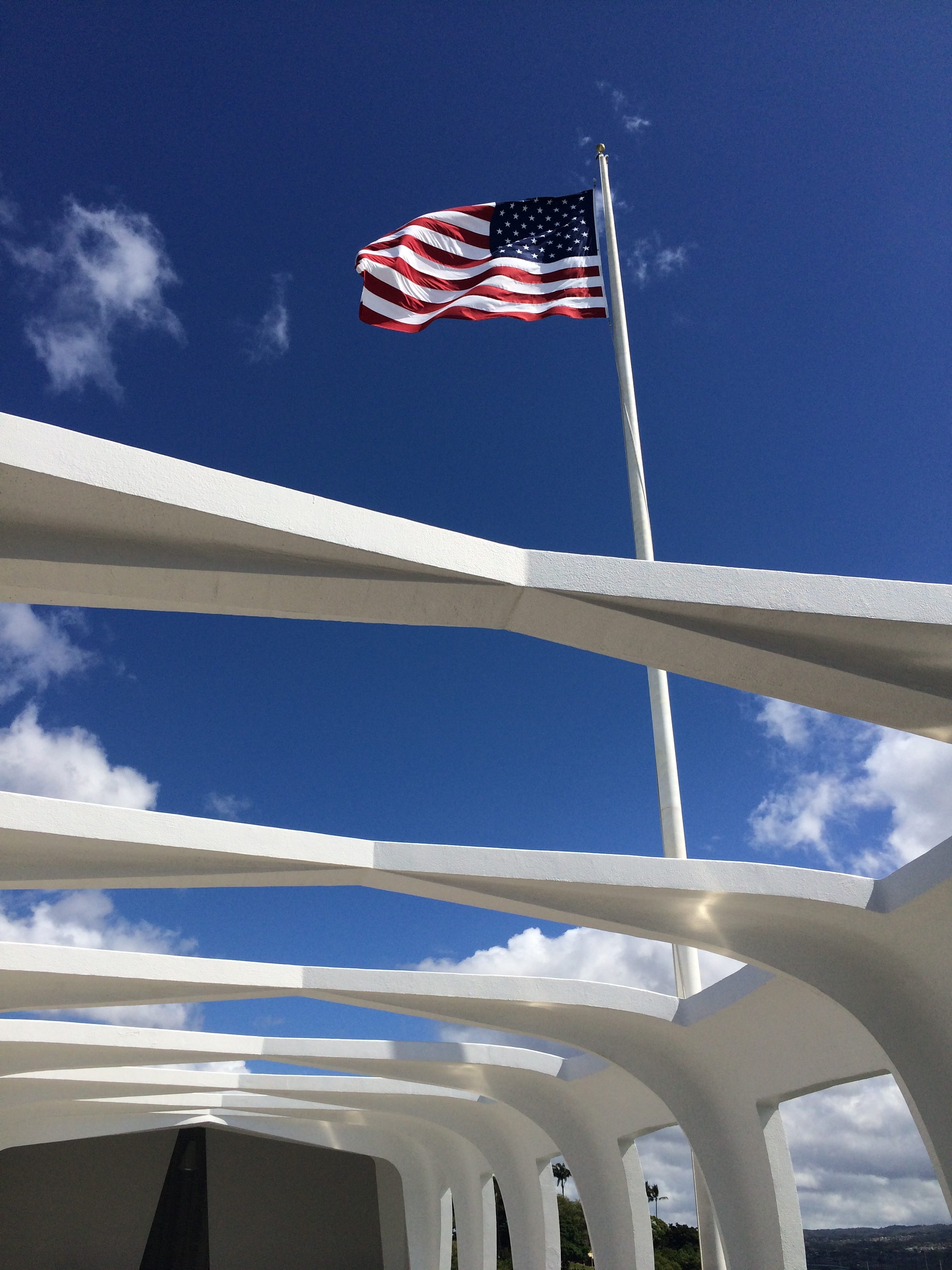 American Flag flying above the USS Arizona